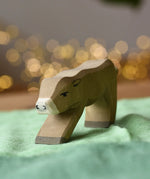 Ostheimer alp calf drinking placed on a green cotton play cloth.