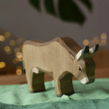 Ostheimer alp cow eating placed on green cotton play cloths. 