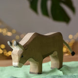 Ostheimer alp cow eating placed on green cotton play cloths. 