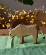 Ostheimer alp cow eating placed on green cotton play cloths. 