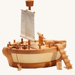 An Ostheimer ark body with a Ostheimer Sail Mast With Look Out attached. There is also an anchor. cannons, steering wheel, treasure chest and barrel on the ark.