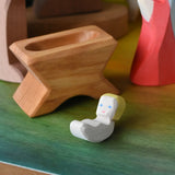 Ostheimer baby jesus and crib wooden toy nativity figure in a small world play scene. 