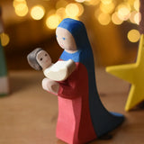 Ostheimer baby wooden toy figure plcaed in the arms of Mary.