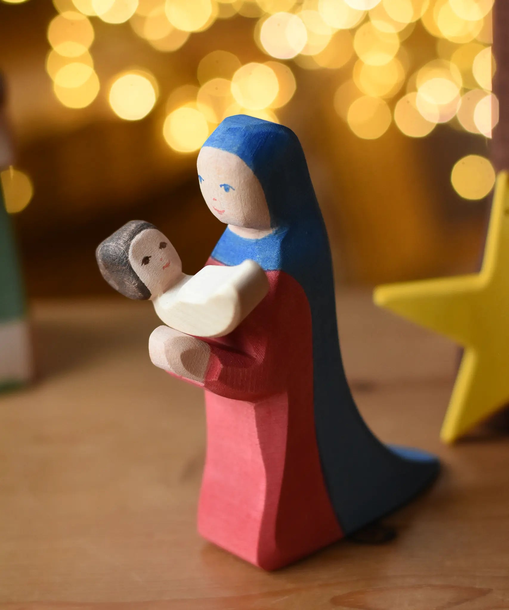 Ostheimer baby wooden toy figure plcaed in the arms of Mary.