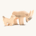 Ostheiemer handmade and hand painted goat kid wooden figure next to the drinking Billy goat figure.