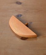 Ostheimer bird perch for nativity stable placed on a wooden surface. 