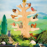 Ostheimer bird tree set up in a play scene with wooden bird figures and animals.