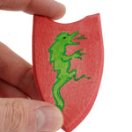 Ostheimer Black Knight Shield  being held in an adult's hand. 
