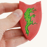 Ostheimer Black Knight Shield  being held in an adult's hand. 