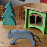 Ostheimer black panther placed in a small world play set up with the small spruce tree and hutch. 