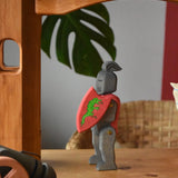 Ostheimer black riding knight handmade wooden toy figure with shield and long sword placed under the castle bride attached to towers.