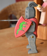 Ostheimer black riding knight handmade wooden toy figure with shield and long sword.