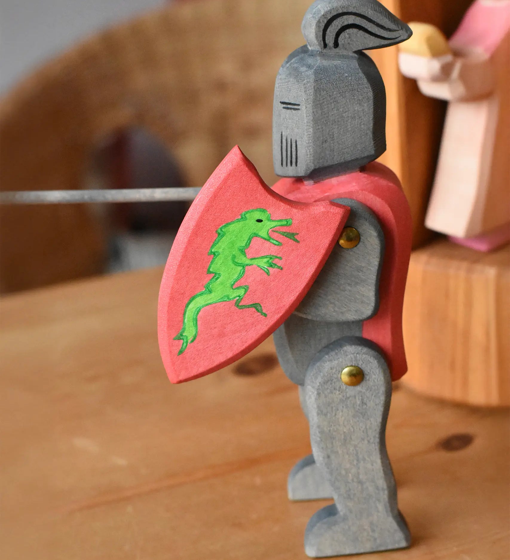 Ostheimer black riding knight handmade wooden toy figure with shield and long sword.