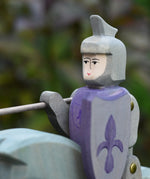 Close up of the Ostheimer blue riding wooden knight sitting on the grey horse.