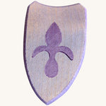 A blue wooden shield with a emblem for a knight on a cream background