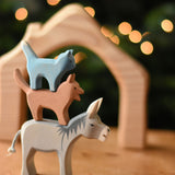 Ostheimer donkey, dog and cat Bremer wooden toy figures stacked on top of each other.  Ostheimer's range of hand crafted, heirloom quality wooden toys are available to buy at Babipur. 