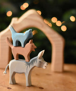 Ostheimer donkey, dog and cat Bremer wooden toy figures stacked on top of each other.  Ostheimer's range of hand crafted, heirloom quality wooden toys are available to buy at Babipur. 