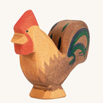 Ostheimer Brown Rooster wooden toy figure on a plain background. 