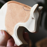 Ostheimer brown and white ox wooden toy figure, close up of the face.