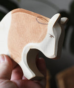 Ostheimer brown and white ox wooden toy figure, close up of the face.