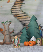 A selection of wooden toys from various brands set up in a small world play scene set up with the Lanka Kade Hermit figure at the front.
We stock a wide range of wooden toys from various brands such as Lanka Kade, Ostheimer, Bumbu and more here at Babipur. 