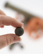 One of the cannon balls from the Ostheimer Large Cannon set being hed