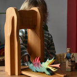 Child placing a dragon on the Ostheimer castle drawbridge.