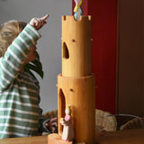 Child pointing at the Ostheimer medieval princess placed in the top of the castle round tower with stairs.