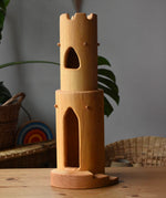 Ostheimer castle round tower with stairs wooden toy building placed on a wooden surface.