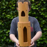 Ostheimer castle round tower with stairs wooden toy building in a child's hands.