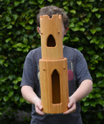 Ostheimer castle round tower with stairs wooden toy building in a child's hands.