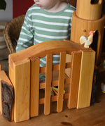 Ostheimer wooden castle trellised gate  with castle walls either side and a castle round tower in the background.
