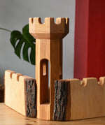 Two Ostheimer large wooden castle walls with a round tower inbetween them.
