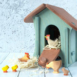 Ostheimer chicken house surronded by Ostheimer hen and chick figures. 
