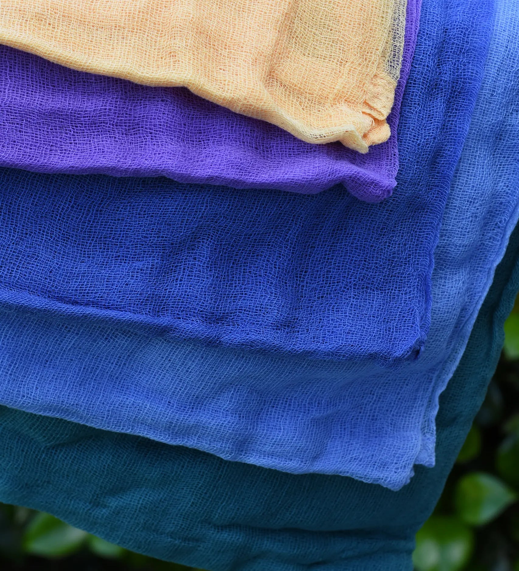Close up of the Ostheimer Christmas decoration scarves play cloths draped over a child's arm.