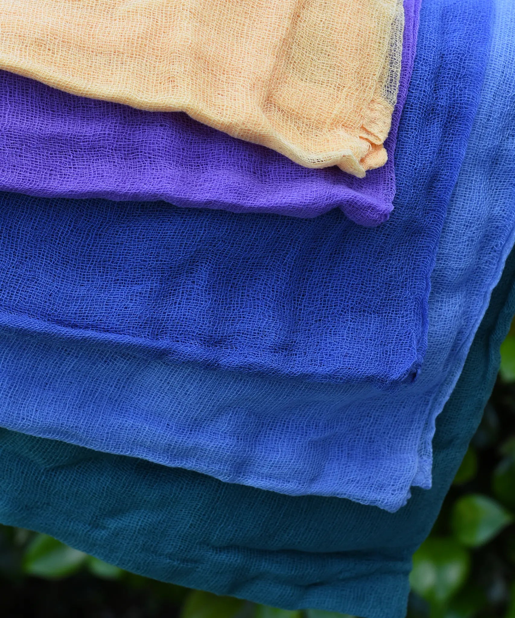 Close up of the Ostheimer Christmas decoration scarves play cloths draped over a child's arm.