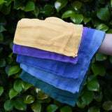 Ostheimer Christmas decoration scarves play cloths draped over a child's arm.