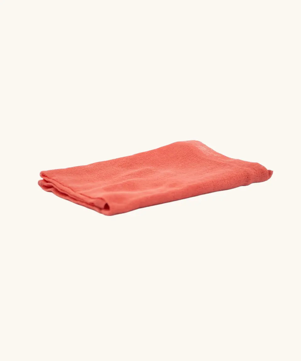 Ostheimer cinnabar orange decoration play cloth scarf folded.