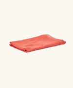 Ostheimer cinnabar orange decoration play cloth scarf folded.