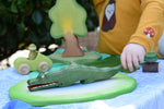 Ostheimer crocodile wooden toy figure child holding the tail.
