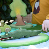 Ostheimer crocodile wooden toy figure child holding the tail.