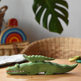 Small Ostheimer crocodile placed n the back of the large crocodile figure.