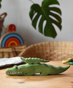 Small Ostheimer crocodile placed n the back of the large crocodile figure.