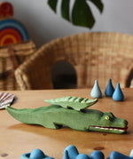 Small Ostheimer crocodile placed n the back of the large crocodile figure.