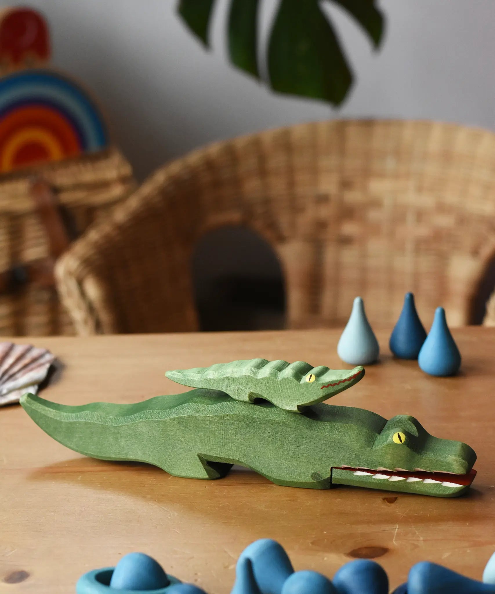 Small Ostheimer crocodile placed n the back of the large crocodile figure.