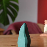 Ostheimer dark green bush toy scenery piece placed on a wooden surface.