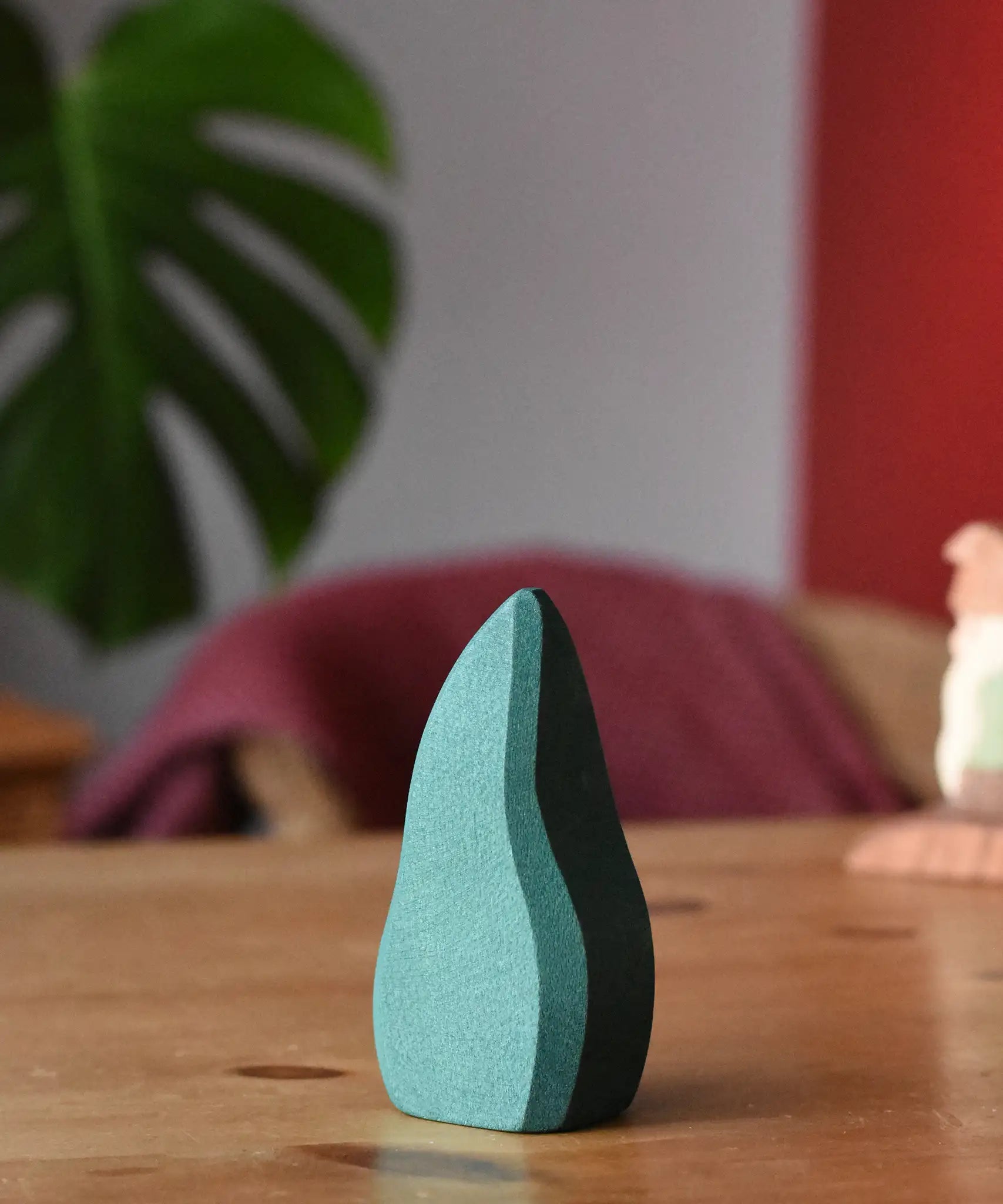 Ostheimer dark green bush toy scenery piece placed on a wooden surface.