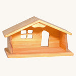 Ostheimer dolls house wooden toy on a plain background.