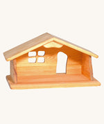 Ostheimer dolls house wooden toy on a plain background.