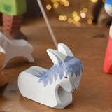 Ostheimer donkey wooden toy from the nativity set with cardboard diorama scene. 